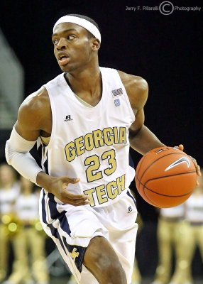 Georgia Tech G Reed looks for an open teammate as he dribbles around the right side