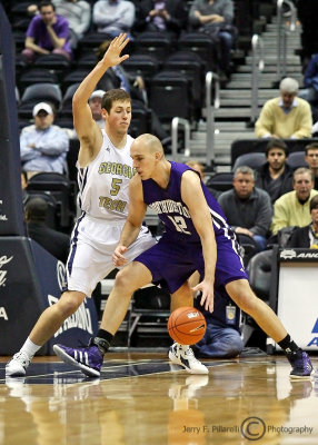 Georgia Tech C Miller works to keep Northwestern C Luka Mirkovic out from under the basket