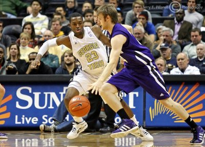 Georgia Tech G Reed stays in front of a Northwestern ball handler
