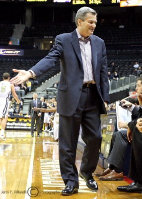 Northwestern Wildcats Head Coach Bill Carmody makes a point to his bench