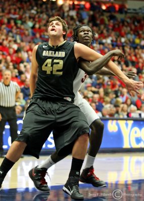 Wildcats F Angelo Chol fights for position with Golden Grizzly C Petros