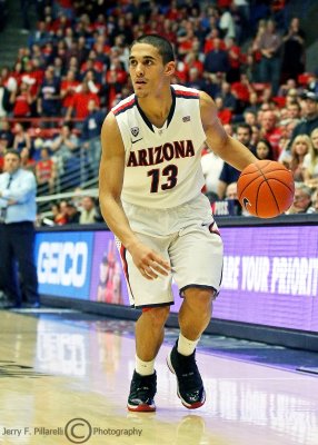 Arizona G Johnson dribbles along the sidelines