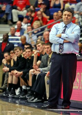 Oakland Golden Grizzly Head Coach Greg Kampe watches his team from the sidelines