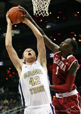 Georgia Tech C Nate Hicks elevates for a shot against Alabama F JaMychal Green…