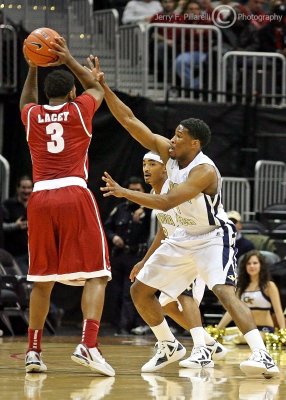 Georgia Tech G Nick Foreman stays in front of Alabama ball handler G Trevor Lacey