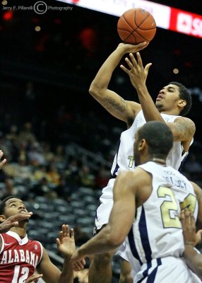 …Georgia Tech G Rice gets his shot off in a crowd