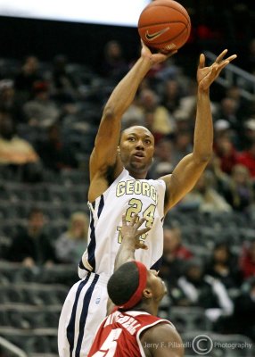 Georgia Tech F Holsely shoots over Alabama F Mitchell