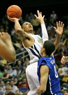 Georgia Tech G Rice puts up a one handed shot over Duke G Austin Rivers