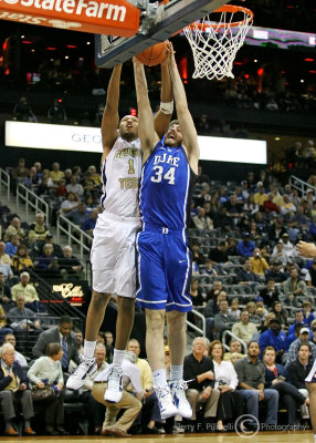 Yellow Jackets F Julian Royal fights with Blue Devils F Ryan Kelly for a rebound under the basket