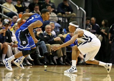 Yellow Jackets G Jordan gets low to defend Blue Devils G Quinn Cook