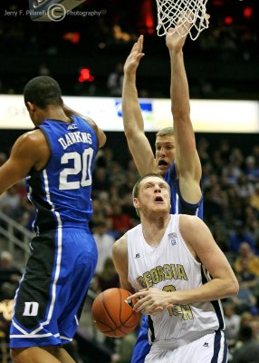 Georgia Tech C Nate Hicks is striped of the ball under the basket