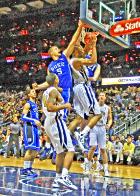 Georgia Tech F Holsey is pressured by Duke F Mason Plumlee as he attempts a layup