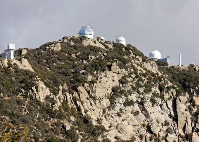Several telescopes as seen from the road to the observatory