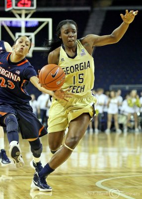 Tech G Tyaunna Marshall dribbles to the goal with Cavs G Ataira Franklin in pursuit
