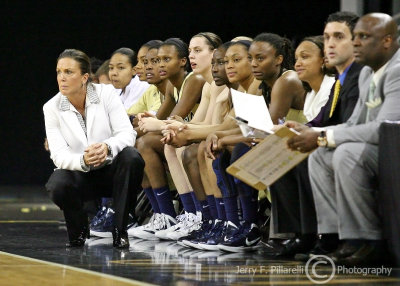 Georgia Tech Yellow Jackets Head Coach MaChelle Joseph watches play from in front of the Tech bench