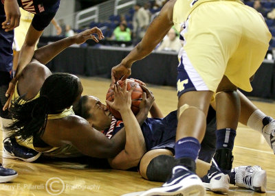 Virginia F Jazmin Pitts fights for possession of a loose ball