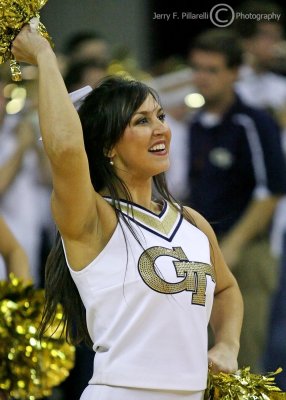 Georgia Tech Cheerleader works the baseline during a timeout