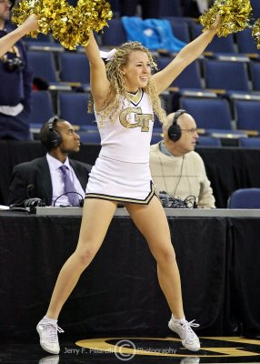 Georgia Tech Yellow Jackets Cheerleader performs during a break in the action