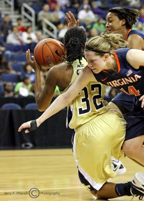Jackets F Regins works to get rid of the ball after being trapped by Cavaliers G Lexie Gerson