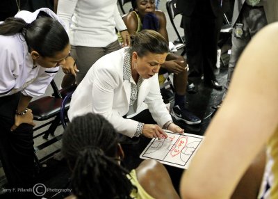 Georgia Tech Yellow Jackets Head Coach MaChelle Joseph scribbles instructions for her team during a timeout