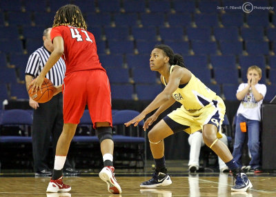 Jackets G Tyaunna Marshall gets low to defend Wolfpack F Lakeesa Daniel