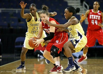 …Georgia Tech PG Walthour moves with G Sydney Wallace to trap NC State G Tasler