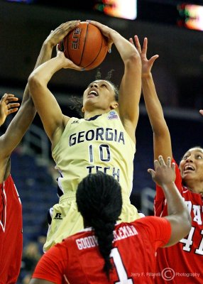 Yellow Jackets F Danielle Hamilton-Carter shoots a short jumper in a crowd of Wolfpack defenders