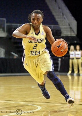 Georgia Tech G Mo Bennett drives around the top of the key