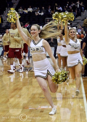 Jackets cheerleaders lead the team onto the court