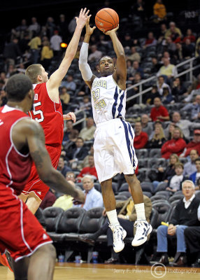 Tech G Brandon Reed elevates to shoot the jumper over NC St. F Wood