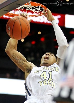 Yellow Jackets G Rice launches himself for a monster dunk