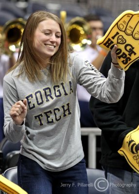 Jackets Fan dances to the band playing during a timeout