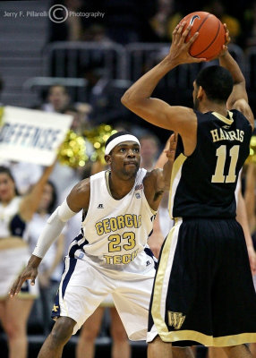 Yellow Jackets G Brandon Reed gets in the face of Demon Deacons G Harris