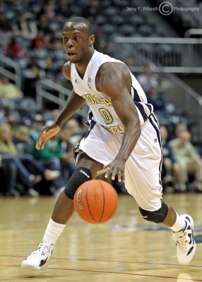 Georgia Tech G Udofia dribbles over the three point line