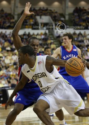 Yellow Jackets G Clinch drives around the Jayhawks defenders
