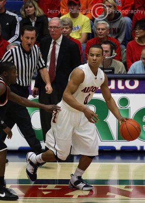 UA G Bayless looks for a lane as Aztecs Head Coach Steve Fisher looks on from the sidelines