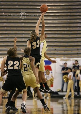 Georgia Tech F Alex Montgomery and Wake Forest F Corinne Groves simultaneously make contact at the tip-off
