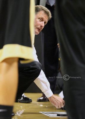 Wake Forest Demon Deacons Head Coach Mike Petersen draws out a play during a timeout