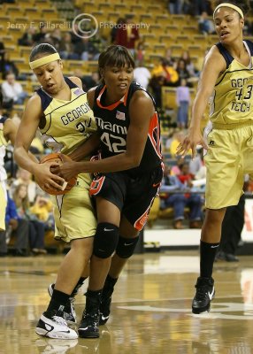 Georgia Tech G Iasia Hemingway attempts to steal the ball from Miami C Carla Williams
