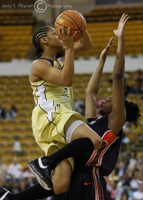 Jackets G Jill Ingram soars over a Miami defender on the way to a basket