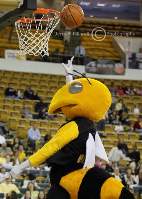 Buzz lays in an uncontested shot during halftime festivities