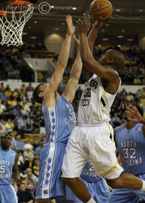 Tech F Smith puts a shot up in the paint over Heels F Hansbrough