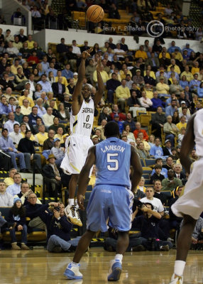 Yellow Jackets G Lewis Clinch takes shot from beyond the arc