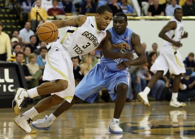 Yellow Jackets G Miller is closely guarded by Tar Heels G Lawson