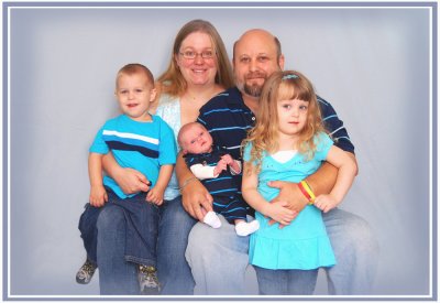 Our first real family portrait. The original looks much better and a 20X30 inch version hangs in our home.