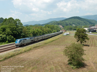 Amtrak 50 leaving town forthe mountain and Q130 behind heading for the river. copy.jpg
