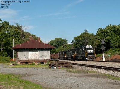 Two rebuilt EMDs lead a loaded ballast train west at Forest Va. copy.jpg