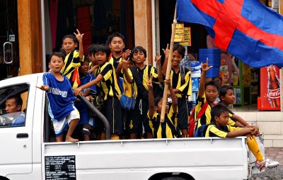 Kids celebrating victory of local football team