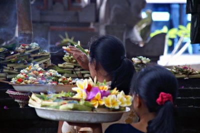 Balinese women performing traditional offerings