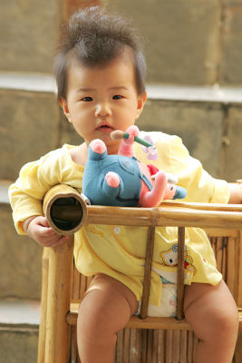 Lara on her meal chair (oldies bamboo chair)